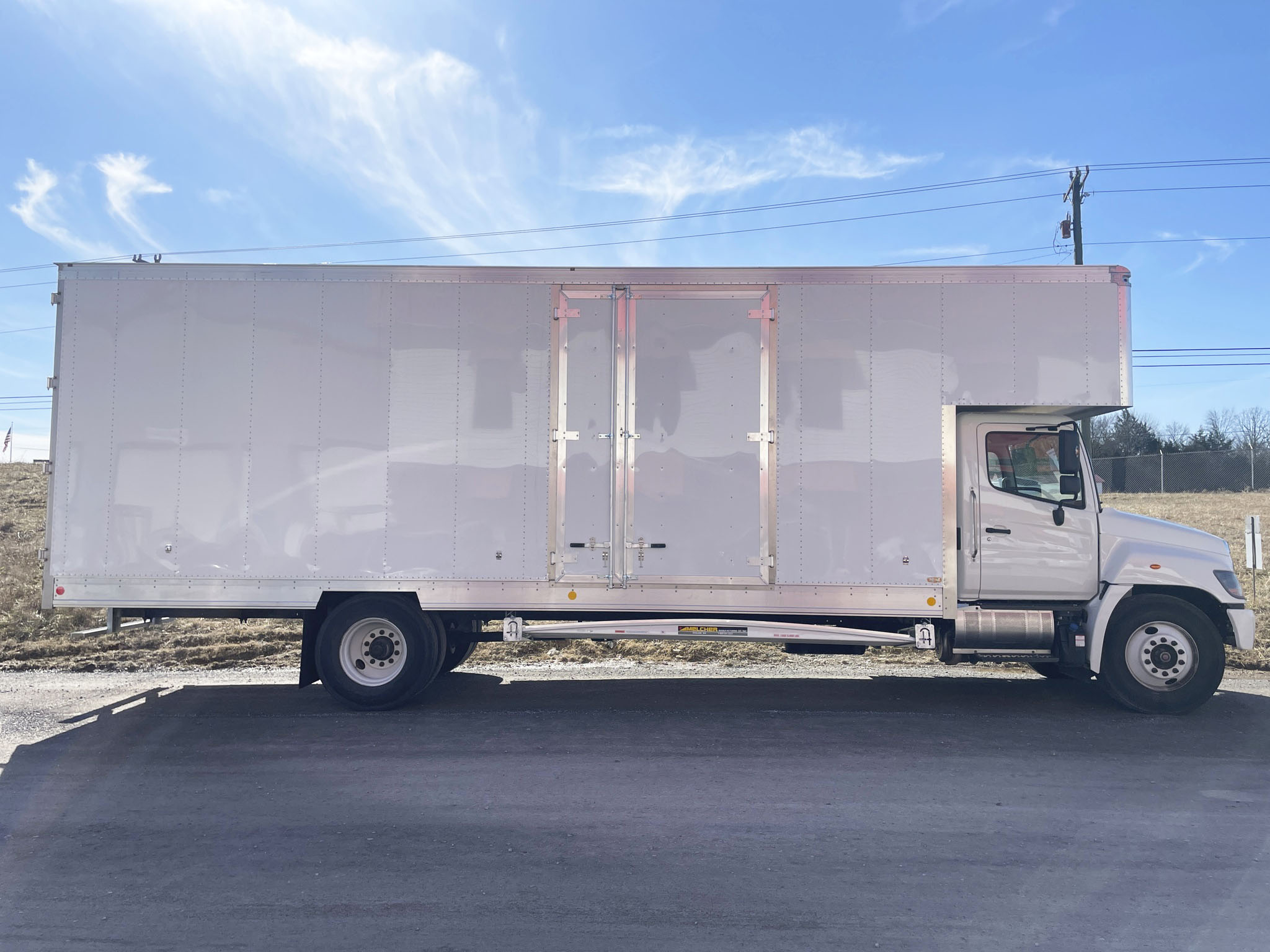 An Allvan moving van body mounted on a truck chassis, seen from the side