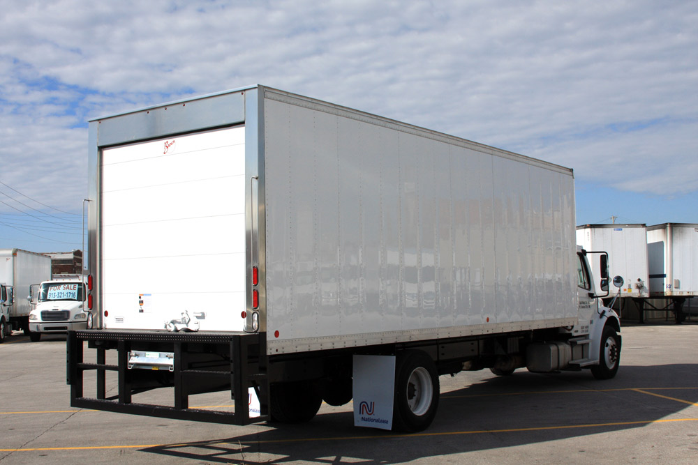 A Brown Industries refrigerated van body on a truck chassis, rear three-quarter view