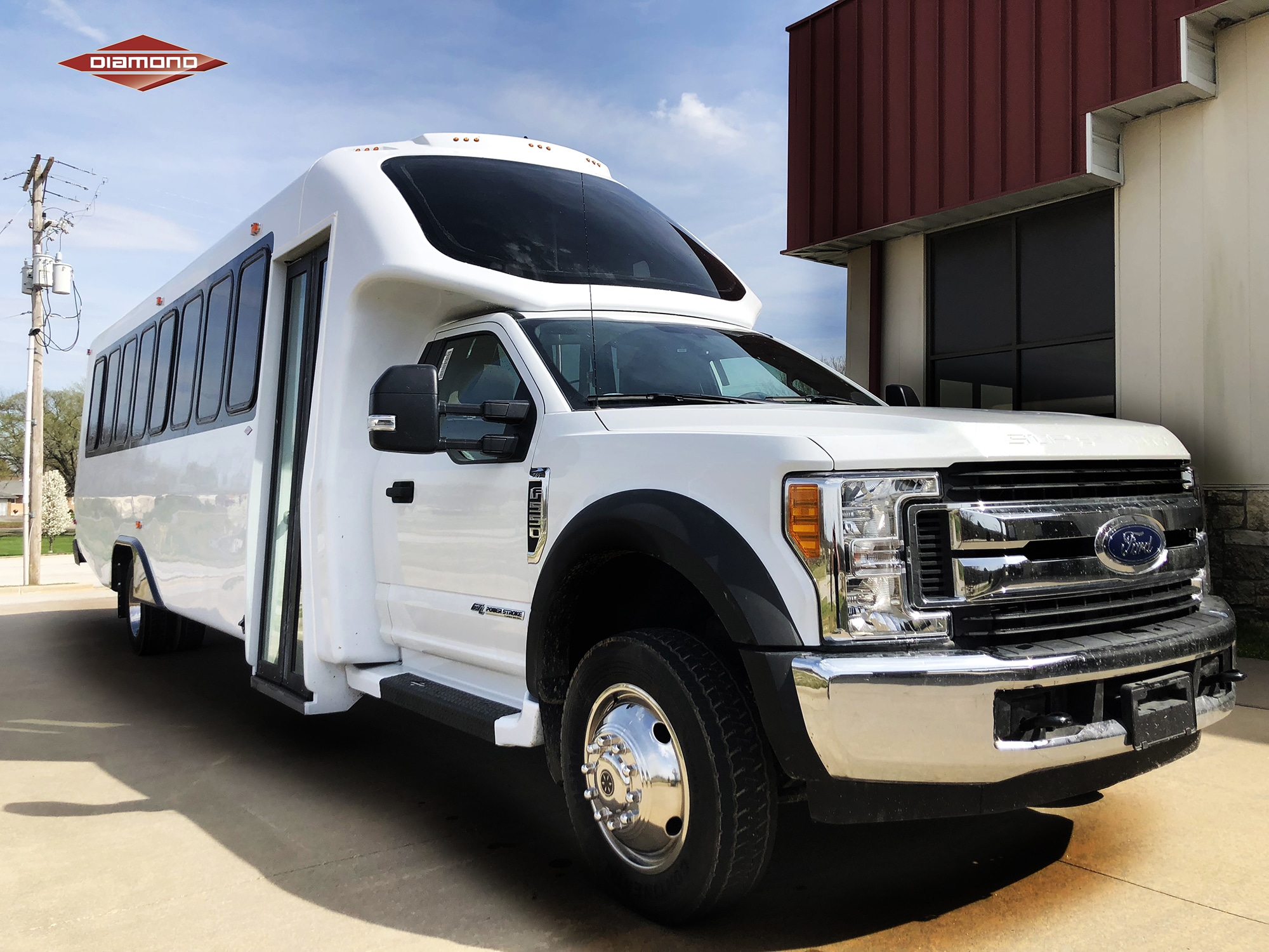 A finished Diamond Coach composite passenger bus outside the plant